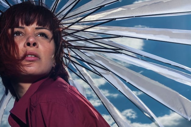A close-up still from an independent film showing a character holding a broken mirror. The reflection in the shards of glass distorts the character's face, symbolizing fractured identity or inner turmoil.