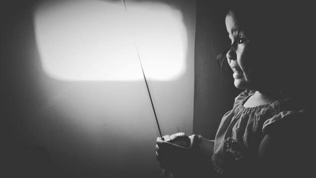 A split-screen image showing a traditional film critic writing in a dimly lit office on one side, contrasted with a group of young people live-streaming their movie reactions on the other side, emphasizing the clash between old and new forms of film criticism.