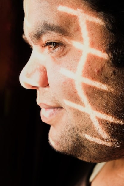 A close-up shot of an actor's face, expressing a subtle mix of vulnerability and resilience. The lighting is soft and natural, highlighting the character's emotional depth. The background is blurred, focusing attention on the actor's nuanced performance.