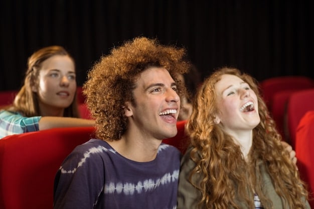 A group of friends enjoying a movie together in a theater, laughing and talking. Focus on the social aspect and the shared experience.