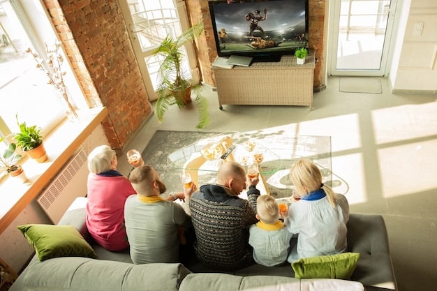 A cozy living room setup with a large screen TV displaying a new movie, comfortable seating, and a family enjoying the movie together, highlighting the convenience of streaming at home.