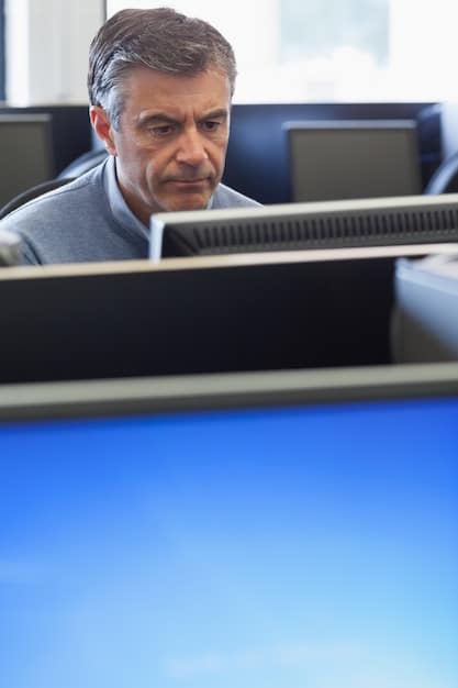 A close-up shot of the director, intensely focused, reviewing footage on a monitor. The monitor shows a scene with intricate visual effects. Soft, ambient light illuminates the director's face, highlighting their concentration.