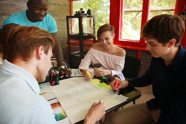 A group of animation students participating in a hands-on workshop, learning techniques from industry professionals, with a focus on collaboration and skill-building.