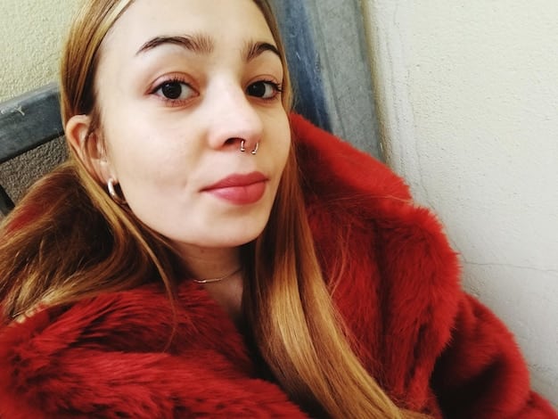 A close-up of Kylie Jenner in her late teens, subtly enhanced lips and slightly more contoured cheekbones, with professional makeup highlighting these features. Her hair is styled elegantly, and she exudes a growing confidence.