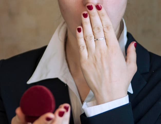 A close-up shot of Blake Lively's hand adorned with her engagement ring during an interview. The ring is sparkling and prominently displayed.
