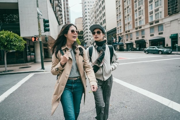 A paparazzi photo of Zendaya and Tom Holland holding hands while walking down a street in New York City, both wearing casual outfits and sunglasses.