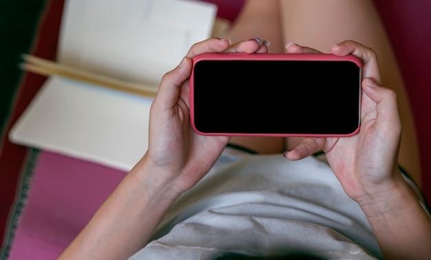A close-up of a hand holding a smartphone displaying a K-drama on a streaming app. The focus is on the screen and the vibrant colors of the show.